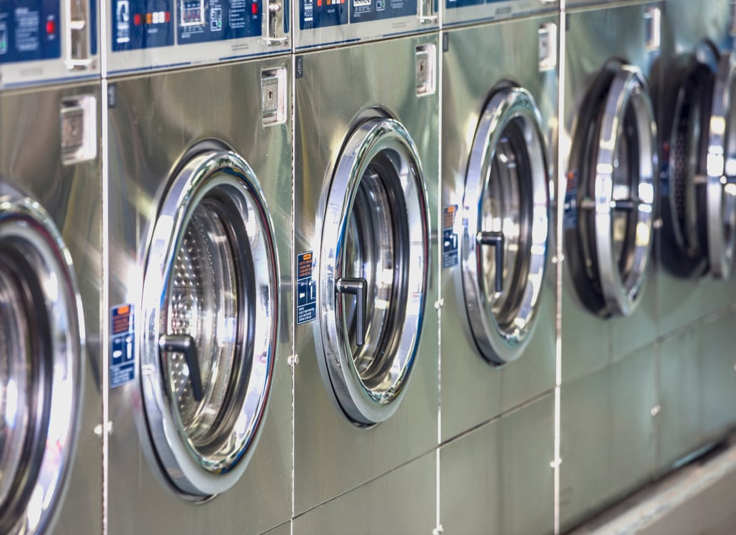 Washers and dryers in laundromat.